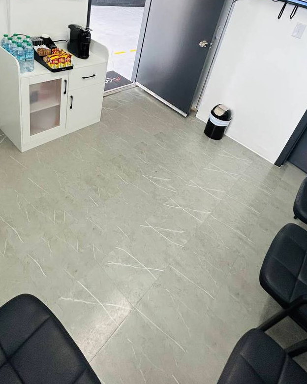 Lane Auto customer waiting room with chairs and a refreshment station